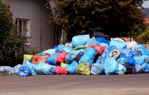 Workers loading commercial waste into secure containers